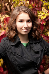 beautiful brunette lady near tree with yellow leaves