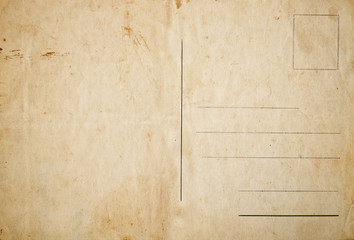 Reverse side of an old stained postcard