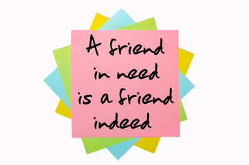 Proverb "A friend in need is a friend indeed" written on bunch o