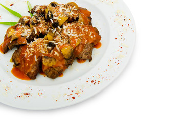 Meat under tasty sauce in plate