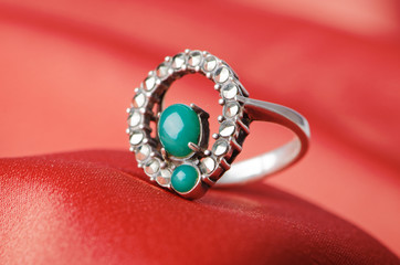 Jewellery ring on the satin background
