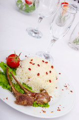 Lamb ribs with rice served in the plate