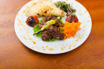Meat cuisine - kebab served in plate