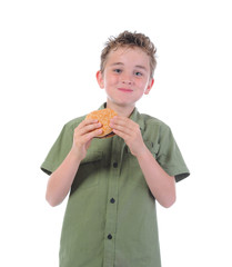 Little boy eating a hamburger