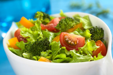 Vegetable salad with tomato, broccoli, yellow bell pepper