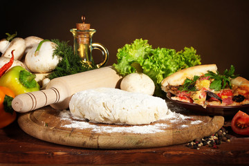 delicious pizza dough, spices and vegetables