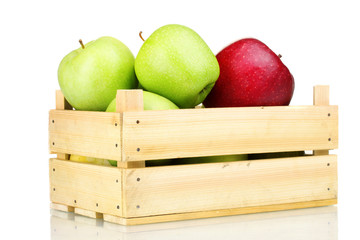 juicy apples in a wooden crate isolated on white