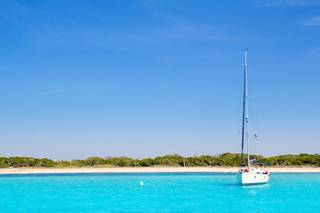 sailboat in turquoise beach of Formentera