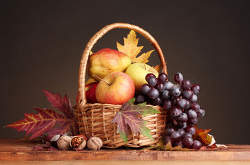 beautiful autumn harvest in basket and leaves