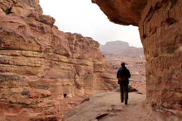 Fototapeta na wymiar Trekking in the canyon gorge formation. Ancient city of Petra, U