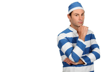 portrait of a man in prisoner costume