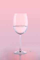 White Wine Glass on Pink Background