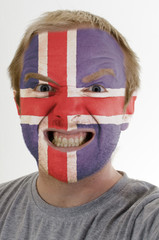 Face of crazy angry man painted in colors of iceland flag