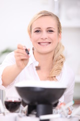 Woman cooking fondue