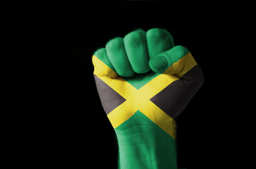 Fist painted in colors of jamaica flag