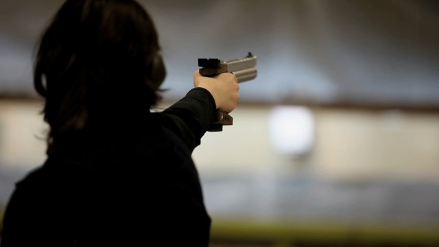 woman with gun