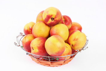 Basket of peaches isolated