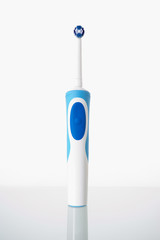 Toothbrush standing on glass shelf