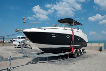 Pleasure boat on the dock, sunny summer day
