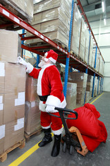 Santa claus looking for presents  in storehouse