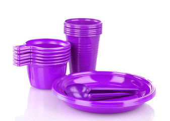 Bright violet plastic tableware isolated on white