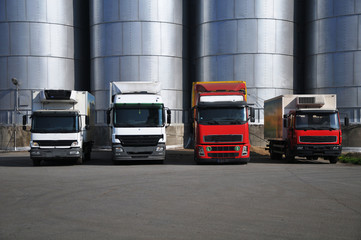 trucks in the parking lot with silos © predrag1