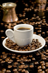 Fototapeta premium coffee cup with coffee beans