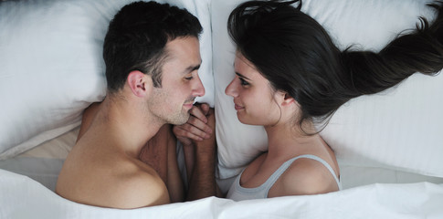 young couple have good time in their bedroom