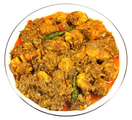 Spicy shrimp curry on a white bowl