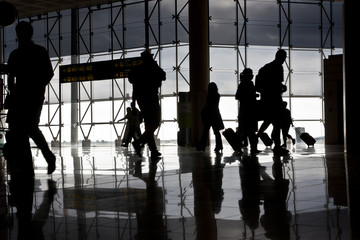 Silhouette of airport travellers