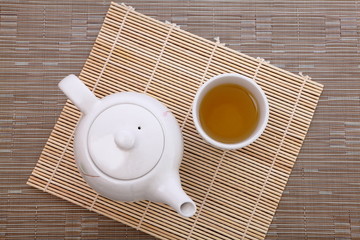 healthful green tea and teapot for afternoon tea time