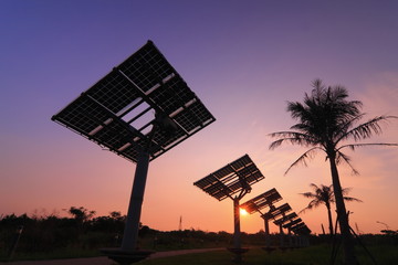 silhouette of solar panel with beautiful sunset