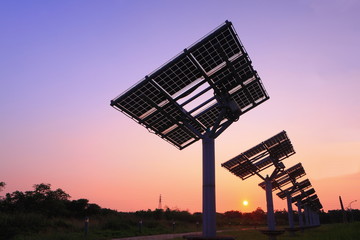 silhouette of solar panel with beautiful sunset