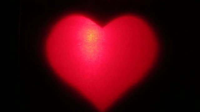 The Pulsating Red Heart On A Dark Background