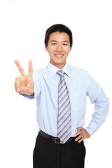 Fototapeta na wymiar young businessman doing the victory sign