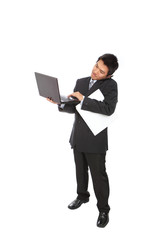 young business man using notebook and speaking mobile phone