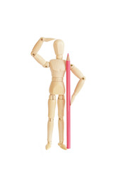 Wooden figure holding pink pencil and looking