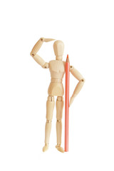 Wooden figure holding orange pencil and looking
