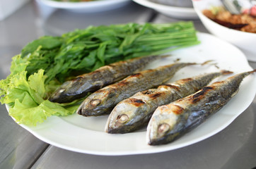 Fried sardine on plate in Asian restaurant