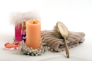Fototapeta na wymiar Candle perfume lotion towel hair brush in spa