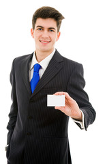 Smiling Bbsiness man handing a blank business card over white ba