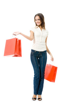 Young woman with shopping bags, isolated