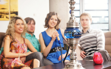 People smoking hookah in a restaurant