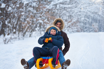 Mother and son on a sledge