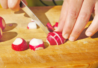 Cutting of garden radish for salad