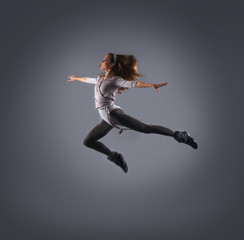 A young and attractive Caucasian dancing woman