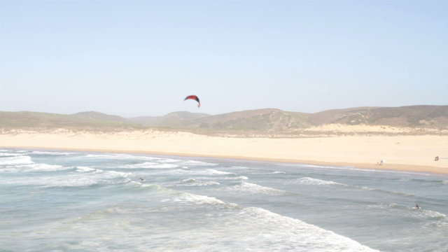 Kite surfer at the beach on Carrapateira in Portugal