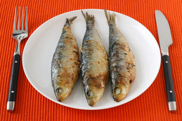 fried sardines on plate