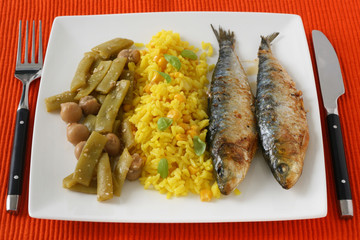 fried sardines with rice and vegetables
