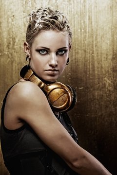 Portrait of an attractive steam punk girl with headphones